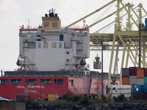 A container ship OOCL Montreal in the Port of Montreal July 20, 2017. Four men were found in a shipping container that is believed to have arrived in Montreal on the ship.