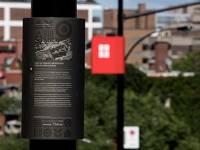 Red squares mark the lampposts the city has spent nearly $1 million on for a 375th legacy project. The signs highlight lampposts with text explaining a bit of the history of Côte-des-Neiges Rd.