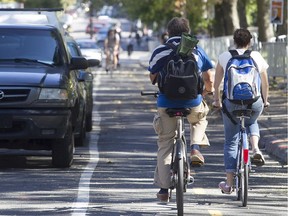 A cyclist travels south on Brébeuf St. near Laurier Ave. on Tuesday Sept. 22, 2015.