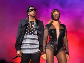 IMAGE DISTRIBUTED FOR PARKWOOD ENTERTAINMENT - Beyonce and JAY Z perform during the On The Run tour at the Georgia Dome on Tuesday, July 15, 2014 in Atlanta, Georgia. (Photo by Rob Hoffman/Invision for Parkwood Entertainment/AP Images)