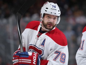 Andrei Markov #79 of the Montreal Canadiens looks on during a break in the action against the Colorado Avalanche at Pepsi Center on February 17, 2016 in Denver, Colorado.