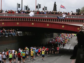 Spectators cheer on runners during the Flora London Marathon in April 2008.