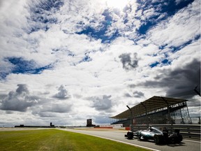 Lewis Hamilton steers his Mercedes during Friday practice for his home British Grand Prix. He posted the second-fastest lap time of the day, 0.047 seconds behind teammate Valtteri Bottas.