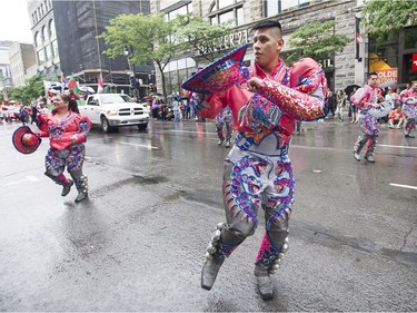 Members of the Bolivian community of Montreal entertain the crowd during the annual Canada Day parade in Montreal, Saturday, July 1, 2017.