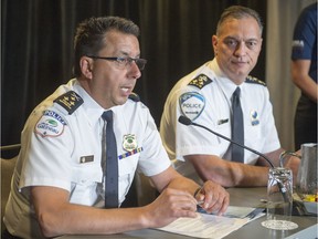 Gatineau police chief and president of the Canadian Association of the Chiefs of Police Mario Harel, left, and Montreal Police Chief Philippe Pichet speak to the media at their conference wrap-up on July 19, 2017 in Montreal.