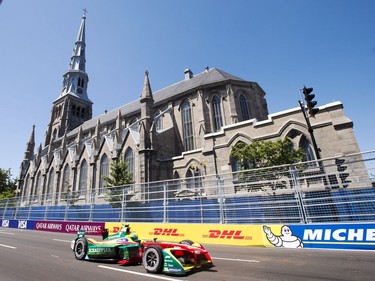 Lucas Di Grassi of Brazil heads toward the finish line on his way to winning pole position for the Montreal Formula E race, in Montreal on Saturday, July 29, 2017. THE CANADIAN PRESS/Ryan Remiorz