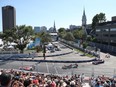 Drivers pass through the first turn at the Montreal Formula ePrix electric car race on July 30, 2017.