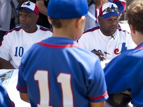 “He was a friend first and he was a teammate second,” Andre Dawson says of Tim Raines, right, signing autographs with Dawson in Dorval in 2012.