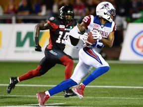 Alouettes wide receiver B.J. Cunningham (85) runs the ball after making a catch in front of Ottawa Redblacks defensive back Imoan Claiborne (19) during the second half of the game on Wednesday, July 19, 2017.