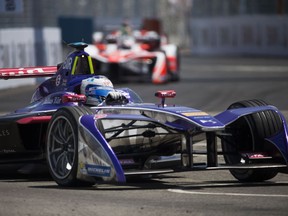 Sam Bird, of SDD Virgin Racing, defends the lead from Mahindra Racing drivers Felix Rosenqvist and Nick Heidfeld during the final day of the Formula E New York City ePrix all-electric auto race Sunday, July 16, 2017, in the Brooklyn borough of New York.