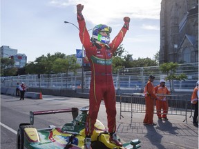 Lucas Di Grassi of Brazil, with ABT Schaeffler, celebrates after finishing in seventh place to win the season three drivers championship at the Montreal Formula ePrix electric car race Sunday, July 30, 2017 in Montreal.