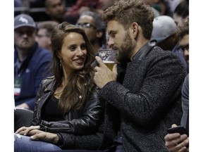 The Bachelor Nick Viall and fiancée Vanessa Grimaldi, seen here at an NBA basketball game last March, will throw a fundraiser in Montreal on July 16 to help special-needs students.