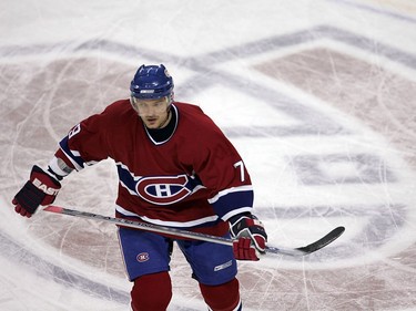 Montreal Canadiens defenceman Andrei Markov skates across the team's logo at center ice in the Bell Centre prior to game against the Florida Panthers in Montreal February 13, 2007.