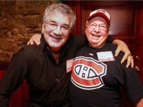 Ian Cobb, right, puts his arm around former Montreal Junior Canadiens tough guy Alan Globensky at the annual Hockey Inside Out summit and charity auction to raise money for the Montreal Canadiens Children's Foundation in 2013.  Cobb has been organizing the annual event since 2007.