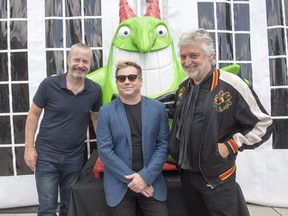 From left, Just for Laughs executive producer Bruce Hills, The Garden of Unearthly Delights producer Scott Maidment and Just for Laughs president and founder Gilbert Rozon pose for a photo at a news conference on July 18, 2017 in Montreal. The two companies announced a partnership to produce a circuit of international comedy festivals.