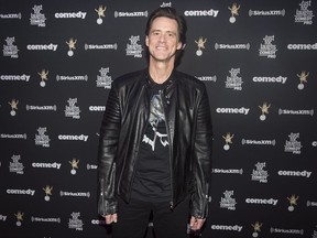 Actor Jim Carrey poses as he arrives for the Just for Laughs awards show at the annual comedy festival in Montreal on Friday, July 28, 2017.