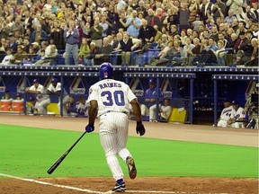 An enthusiastic crowd greets Tim Raines at the Olympic Stadium on April 6, 2001.