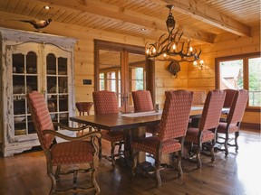An antlers chandelier hangs above the long dining table that can easily sit eight.