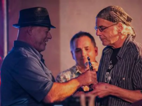 On the left, Grand Chief of Wendake Konrad Sioui with cousin and musician Gilles Sioui. Screenshot from Facebook.