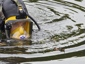 A Surete du Quebec diver searches for evidence, 2011.