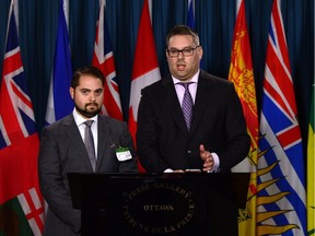 Lawyers Marc-André Séguin, left, and Michael Simkin speak during a news conference on Parliament Hill in Ottawa on Monday, July 17, 2017, about their effoerts on behalf of 'Snowden's Guardian Angels.'