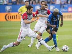Impact's Ballou Tabla, right, breaks away from a challenge by D.C. United's Steve Birnbaum during first half MLS soccer action at Saputo Stadium on July 1, 2017.  The teen is expected to take the front left spot in Montreal's lineup of Ignacio Piatti, who is injured.