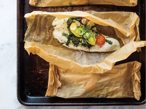 A fillet of fish topped with seasoning makes an easy summer meal if you bake it in a parchment paper packet.