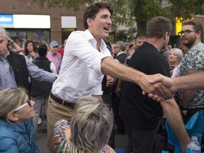 Prime Minister Justin Trudeau shakes hands with people while attending a dinner on the street activity in Roberval Que., Wednesday, July 26, 2017. THE CANADIAN PRESS/Jacques Boissinot ORG XMIT: JQB111
Jacques Boissinot,