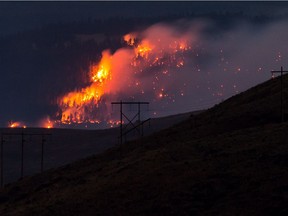 A wildfire burns on a mountain near Ashcroft, B.C., in July 2017.