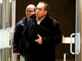 Pasquale Fedele, right, leaves a Montreal courtroom in January. Pascal Patrice follows. The pair presented separate motions in court on Wednesday seeking to have the charges against them dismissed.