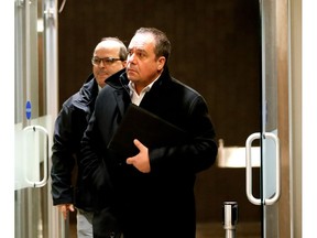 A judge has refused bids by Pasquale Fedele (front) and Pascal Patrice, seen here leaving a courtroom last January, to dismiss charges against them in the Contrecoeur corruption trial.