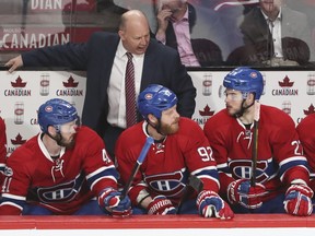 Montreal Canadiens coach Claude Julien speaks to Alex Galchenyuk, right, as Paul Byron, left and Steve Ott listen during 3rd period of game 1 of the first round of the NHL playoffs against the New York Rangers in Montreal Wednesday April 12, 2017.