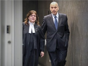 Former Montreal executive committee chairman Frank Zampino leaves the courtroom with lawyer Isabel Schurman for the lunch break in the Contrecoeur corruption trial at the Palais de Justice in Montreal, Monday May 1, 2017.