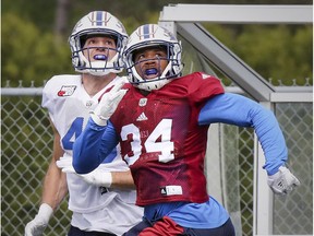 MONTREAL, QUE.: MAY 30, 2017 -- Linebacker Kyries Hebert, right, and fullback Jean-Christophe Beaulieu track the flight of a pass intended for Beaulieu during Montreal Alouettes training camp at Bishop's University in Lennoxville, southeast of Montreal Tuesday May 30, 2017. (John Mahoney / MONTREAL GAZETTE) ORG XMIT: 58691 - 3103
John Mahoney, Montreal Gazette