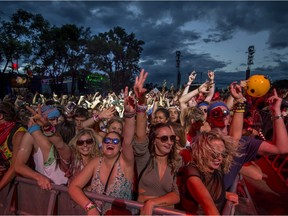 Fans dance along to Major Lazer during the Osheaga Music and Arts Festival at Parc Jean Drapeau in Montreal on Saturday, August 5, 2017.