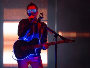 Matt Bellamy of English rock band Muse opens their set during the Osheaga Music and Arts Festival at Parc Jean Drapeau in Montreal on Saturday, August 5, 2017.