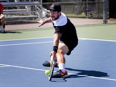 Samuel Monette (CAN) dives to return the ball to Dudi Sela (ISR) during Rogers Cup action in Montreal on Saturday August 5, 2017.