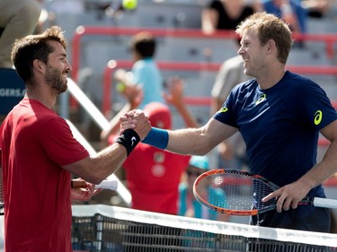 Antoine Leduc, left, (CAN) congratulates  Brendan Klein (GBR) during Rogers Cup action in Montreal on Saturday August 5, 2017. Leduc lost the match 6-0 6-3.