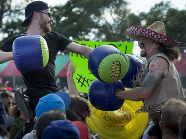 Fans take to battle during Run the Jewels' performance on Day 3 of the Osheaga Music and Arts Festival at  Parc Jean-Drapeau in Montreal on Sunday, Aug. 6, 2017.