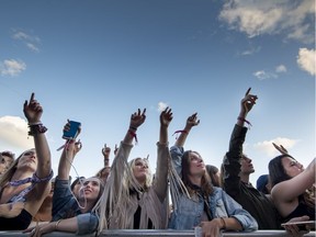 The front row is packed with young fans swaying along to Australian singer-songwriter Vance Joy at Osheaga in 2017.