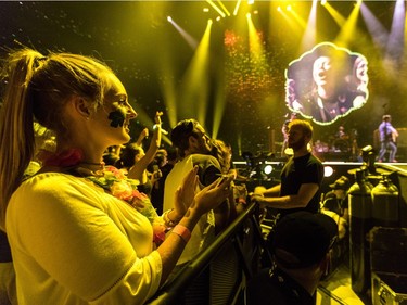 Fans watch Coldplay during concert in Montreal at the Bell Centre on Tuesday, August 8, 2017.