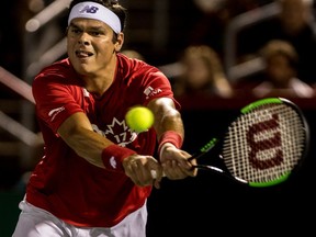 Milos Raonic returns a shot from Adrian Mannarino on centre court at the Rogers Cup at Uniprix Stadium in Montreal on  August 9, 2017.