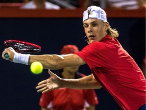 Denis Shapovalov returns a shot from Rafael Nadal on centre court at the Rogers Cup at Uniprix Stadium in Montreal, on Thursday, August 10, 2017.