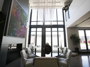 The enormous abstract painting above the dining room table in Andrea Wilde's condo was purchased at the Art Basel Fair in Miami Beach.