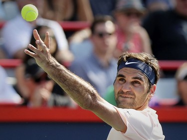 Roger Federer tosses the ball in the air while serving during his straight-set victory over Robin Hasse in the semi-final match of the Rogers Cup tennis tournament in Montreal on Saturday August 12, 2017.
