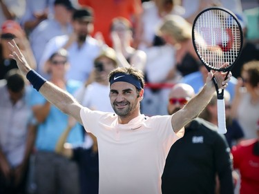 Roger Federer raises his hands in jubilation following his straight-set victory over Robin Hasse in the semi-final match of the Rogers Cup tennis tournament in Montreal on Saturday August 12, 2017.