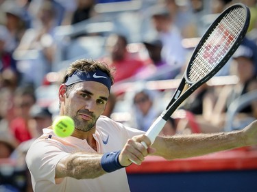 Roger Federer hits a backhand return during his straight-set victory over Robin Hasse in the semi-final match of the Rogers Cup tennis tournament in Montreal on Saturday August 12, 2017.