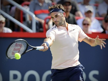Roger Federer hits a forehand return during his straight-set victory over Robin Hasse in the semi-final match of the Rogers Cup tennis tournament in Montreal on Saturday August 12, 2017.
