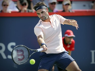 Roger Federer hits a forehand return during his straight-set victory over Robin Hasse in the semi-final match of the Rogers Cup tennis tournament in Montreal on Saturday August 12, 2017.