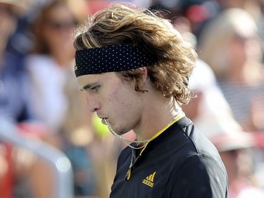 Alexander Zverev bites his necklace between points during championship match against Roger Federer at the Rogers Cup tennis tournament at Uniprix Stadium in Montreal on Sunday, August 13, 2017. Zverev won in straight sets.
